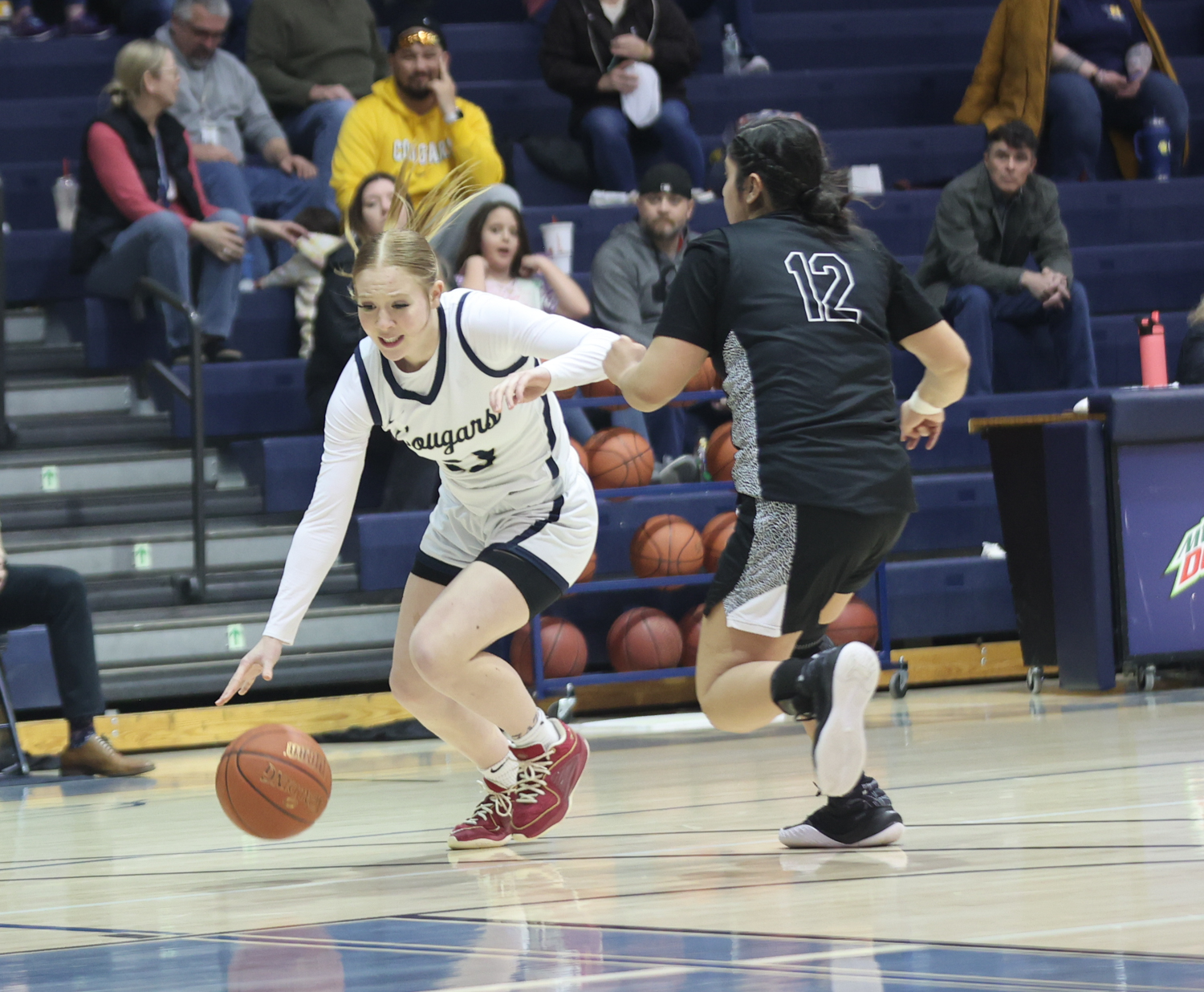 Kiley Smich dribbles to the basket in a first-round playoff game against Trinidad State.