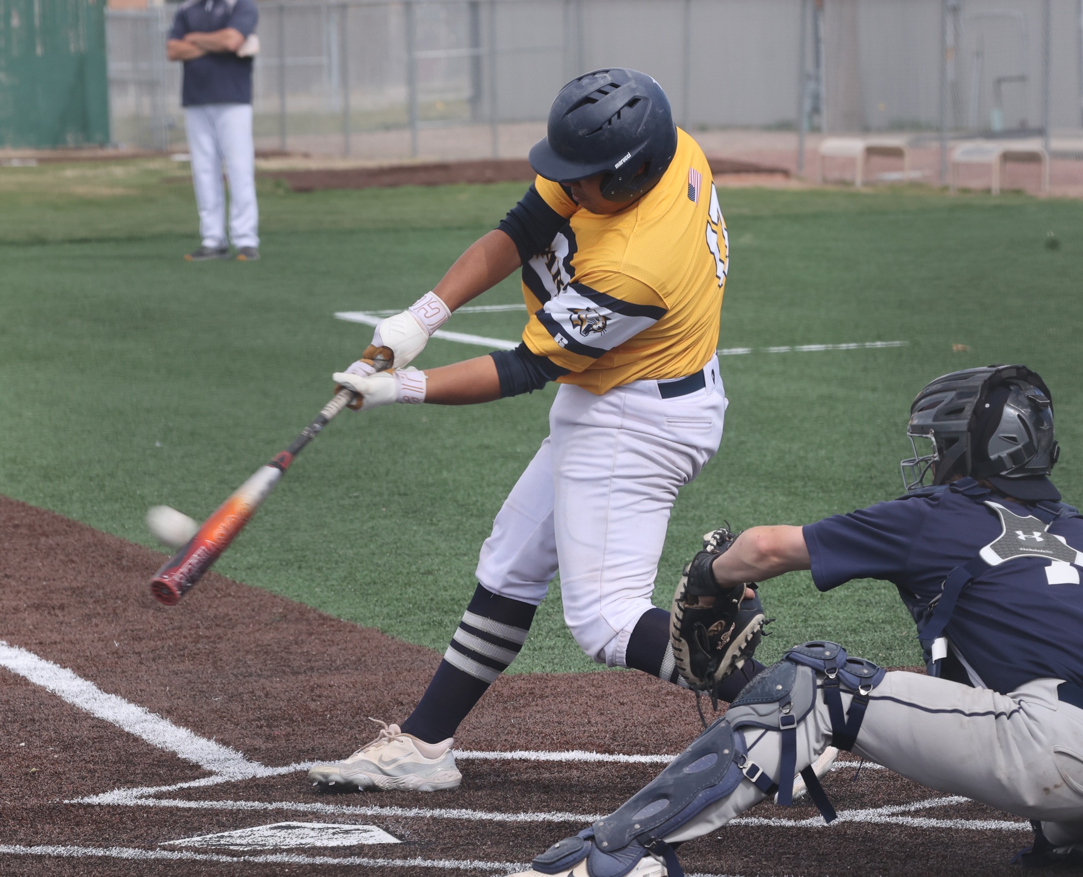 Arturo Montiel makes contact with the ball as he towers the pitch over the fence for a grand slam in a 22-12 win over Otero. WNCC hit 8 home runs in the game to tie a school record.