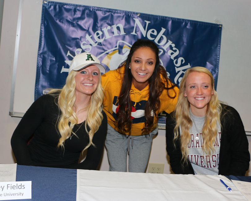 Three softball players ink with four-year schools