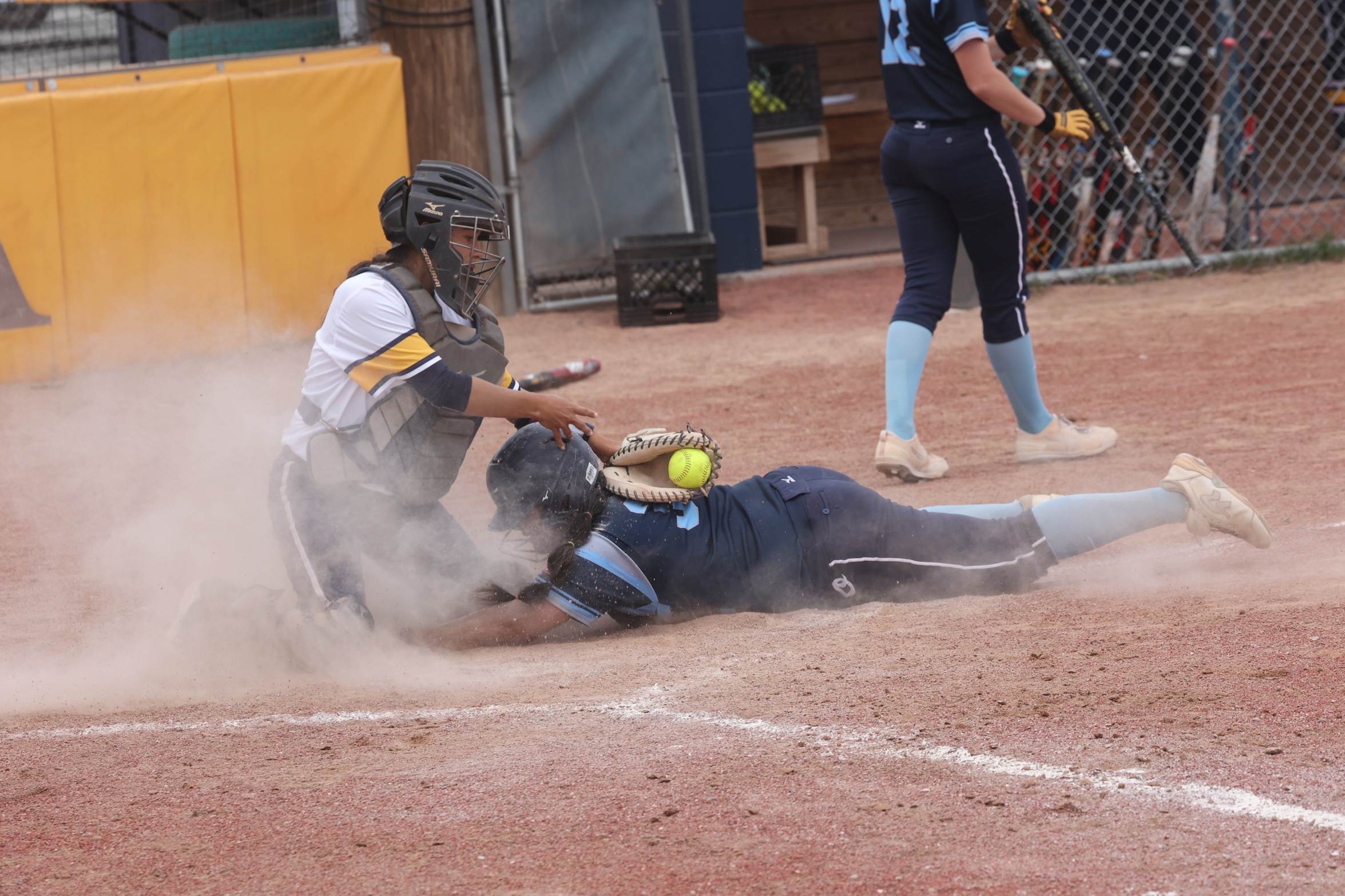 DemiRae Woolsey goes for a tag at home plate.