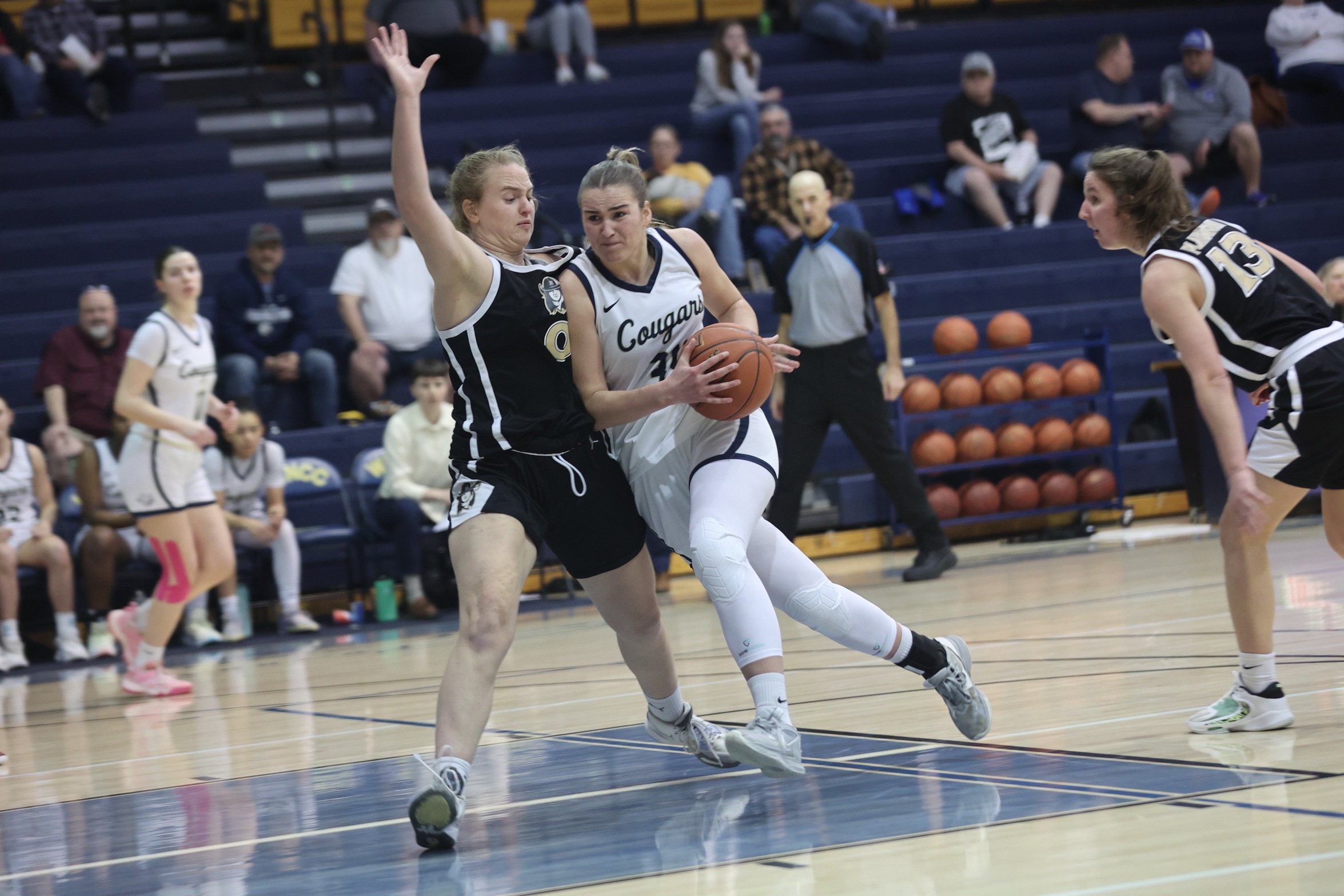 Adelina Urtane drives to the basketball against NJC on Monday.