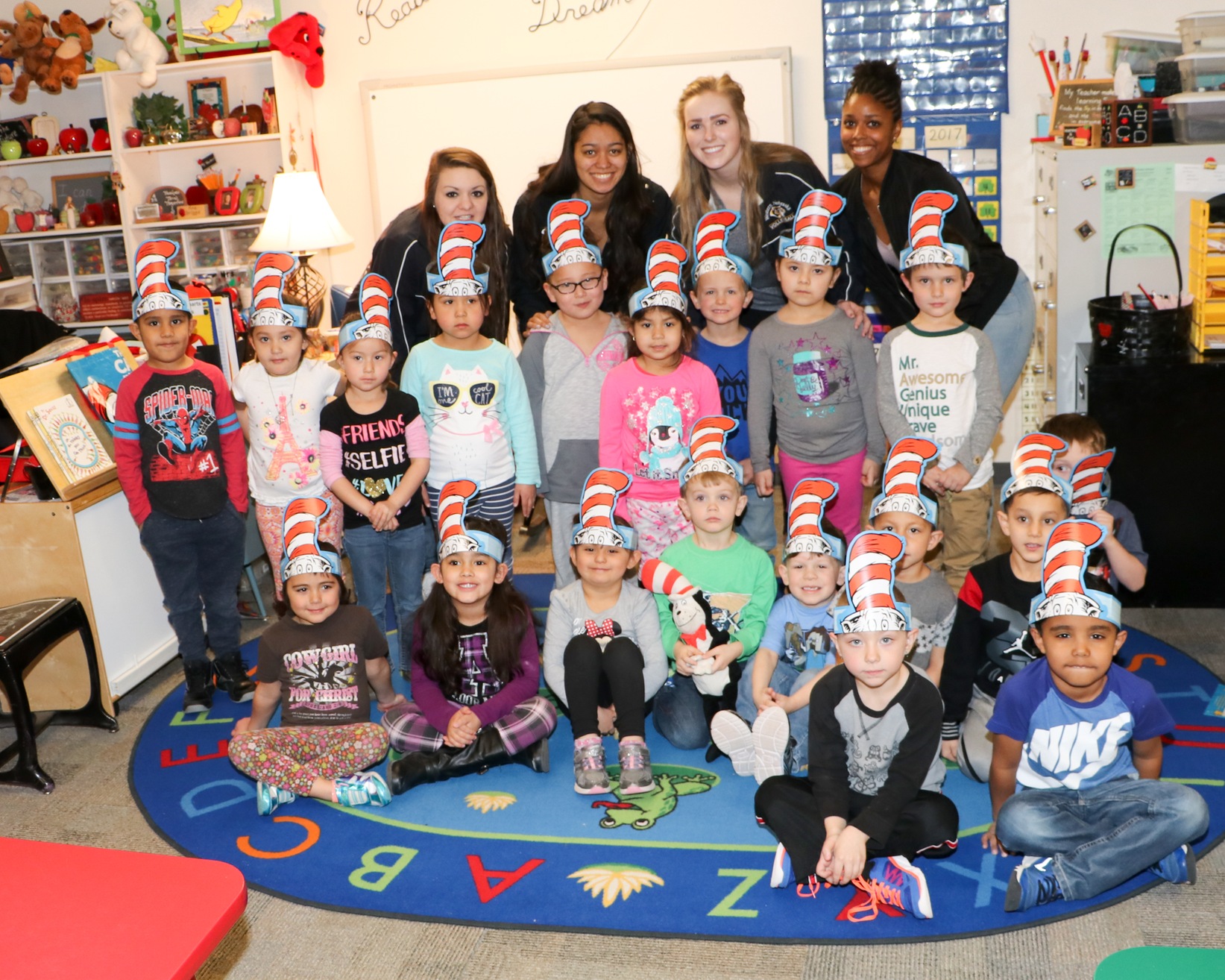 WNCC volleyball players read to pre-schoolers for Dr. Seuss Day