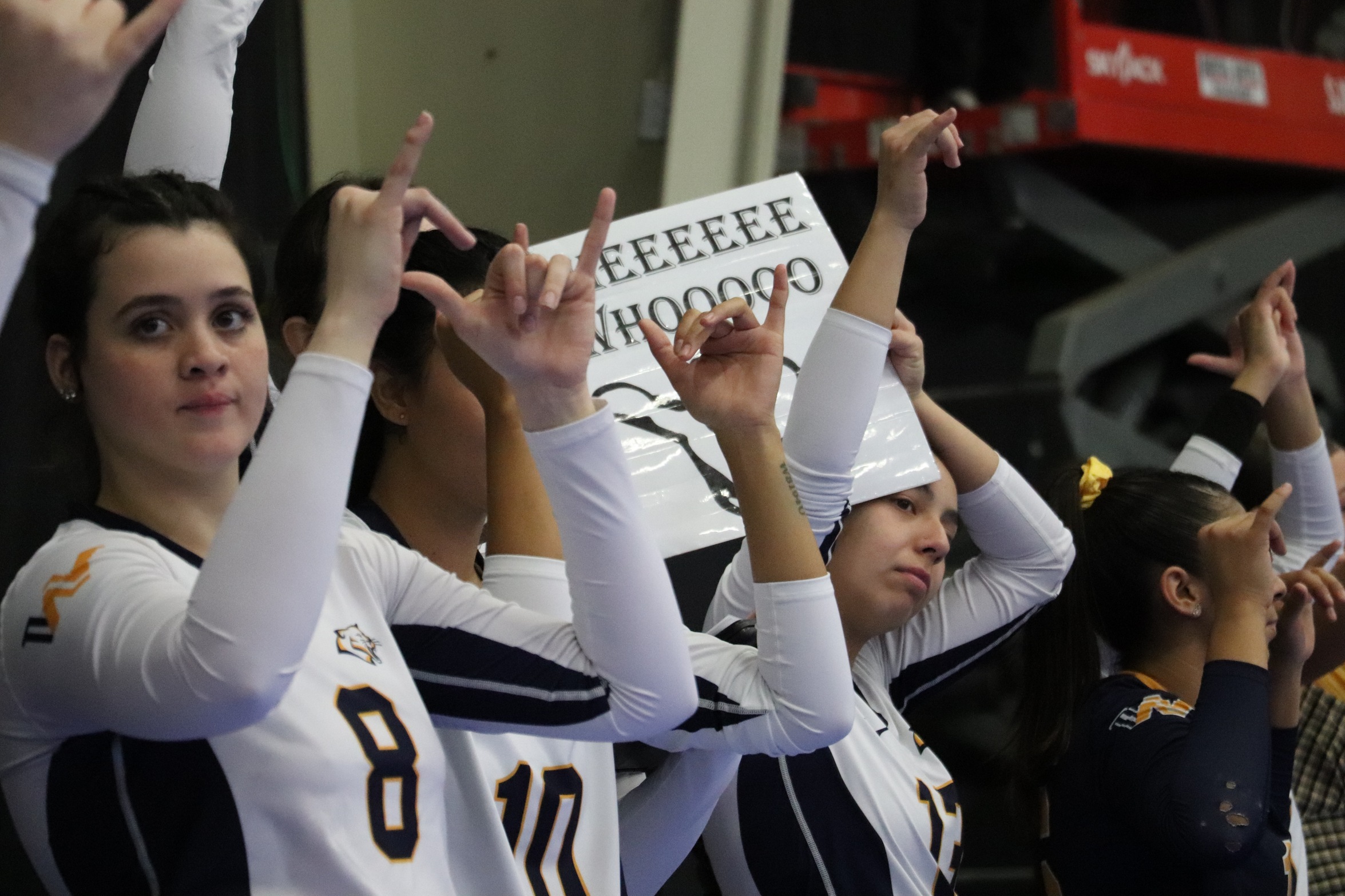 WNCC bench cheering on the Cougars (NJCAA Photo)