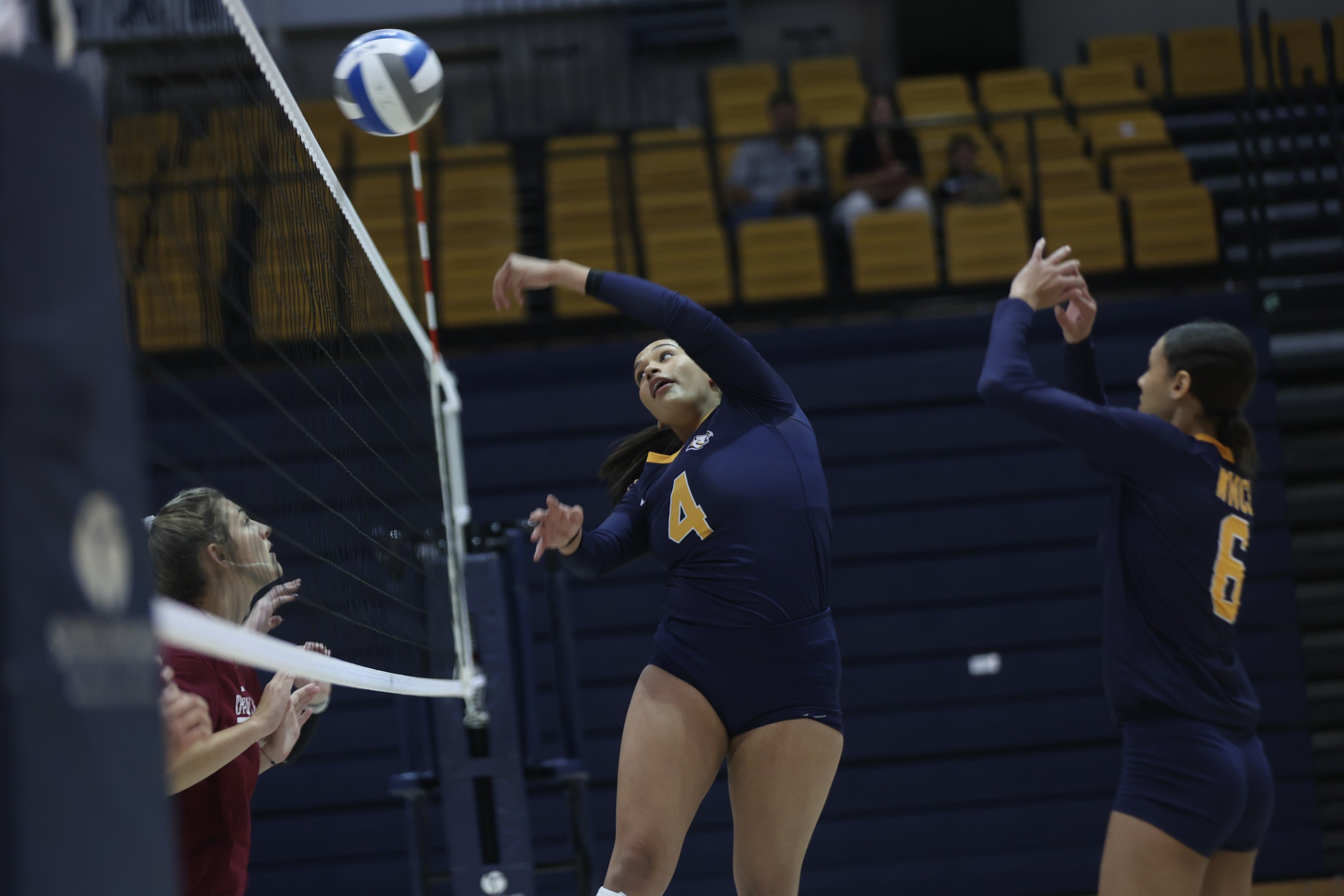 Shanelle Martinez throws the ball over the net during a scrimmage last week.