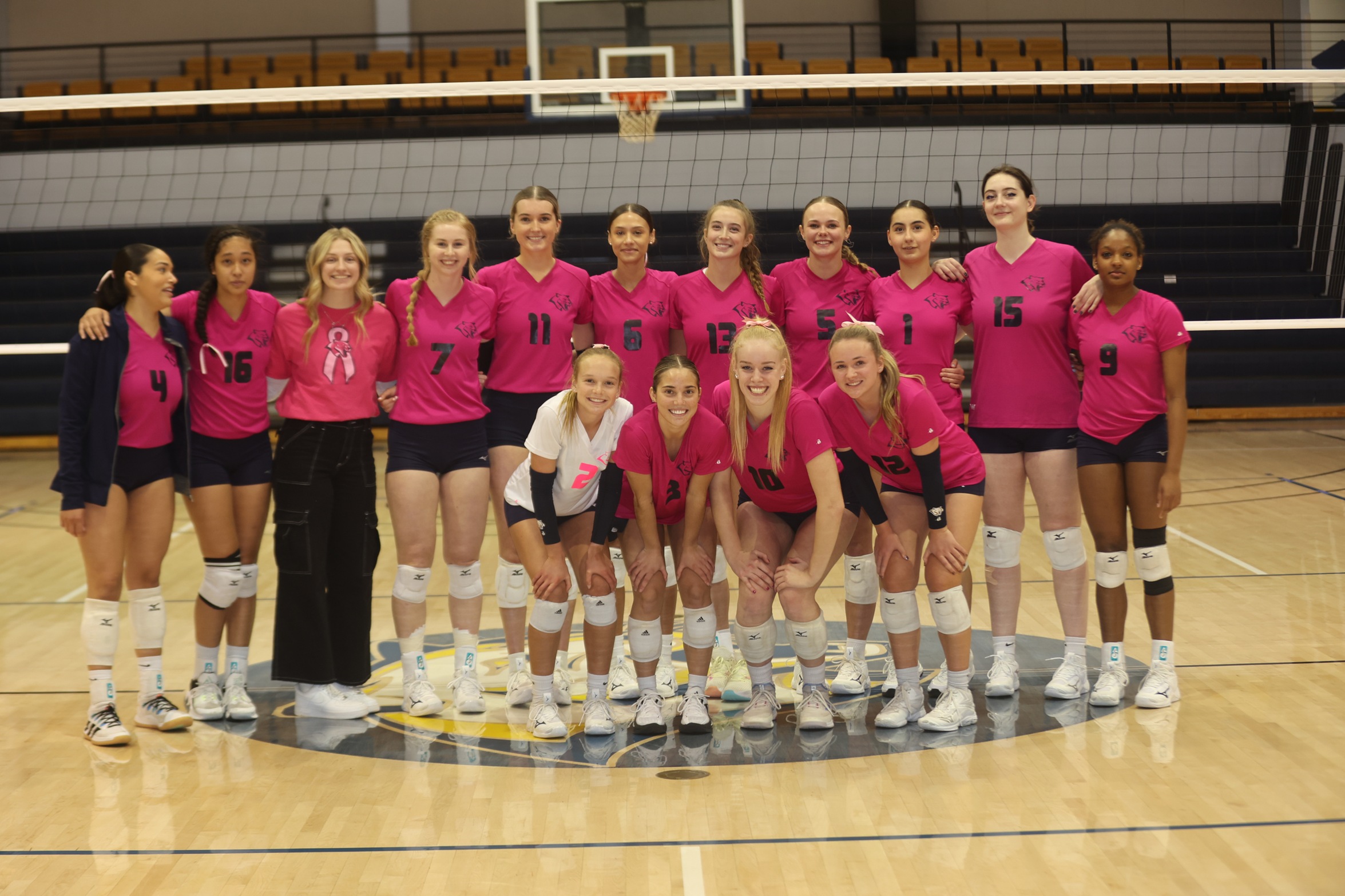 The Cougars in their pink uniforms.